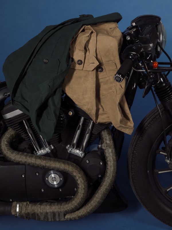 NR Napoli TARGA Jackets in olive and beige waxed cotton styled together against a blue background.